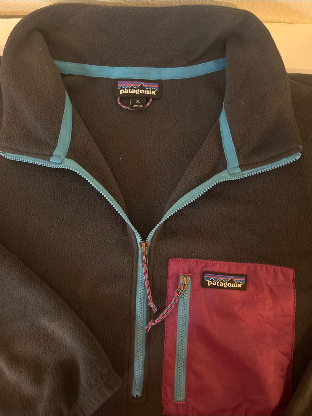 Patagonia Black Fleece Jacket with Teal Trim and Chest Pocket